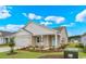 Well-manicured single-Gathering home with a 2-car garage, tidy lawn, and professionally landscaped yard at 3038 Deerberry Place, Longs, SC 29568