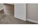 Hallway featuring hardwood floors, white trim, and neutral wall color at 3038 Deerberry Place, Longs, SC 29568