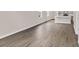 Open-concept living space with sleek hardwood floors and access to the modern kitchen at 3038 Deerberry Place, Longs, SC 29568