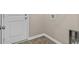 Practical mudroom area with exterior door, utility connections, and durable flooring at 3038 Deerberry Place, Longs, SC 29568