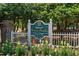 Historic Wachesaw Plantation community sign with white fence and flowering plants at 4569 Carriage Run Circle, Murrells Inlet, SC 29576