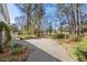 Long winding driveway leads to the home, with a well-manicured yard and lush trees at 4569 Carriage Run Circle, Murrells Inlet, SC 29576