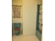 Full bathroom with a unique blue toilet, shower, and seashell wall decorations at 5864 Crestwood Dr., Myrtle Beach, SC 29578