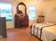 Bedroom featuring antique vanity and natural light through windows, creating a serene and elegant space at 5864 Crestwood Dr., Myrtle Beach, SC 29578