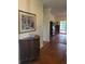 Entry area featuring hardwood floors with an antique hutch and doorway view to living area at 5864 Crestwood Dr., Myrtle Beach, SC 29578