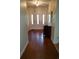 Inviting foyer featuring a gleaming hardwood floor, chandelier, and beautiful entry door at 5864 Crestwood Dr., Myrtle Beach, SC 29578