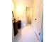 Hallway featuring hardwood floors, with a vanity and a door leading to a bathroom at 5864 Crestwood Dr., Myrtle Beach, SC 29578