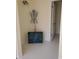 Hallway featuring tiled floors, neutral walls, and vintage decor at 5864 Crestwood Dr., Myrtle Beach, SC 29578
