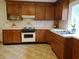 Traditional kitchen with wood cabinets, white countertops, and vintage appliances at 5864 Crestwood Dr., Myrtle Beach, SC 29578