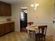 Kitchen eat-in area with traditional wood cabinets, breakfast table and view into dining room at 5864 Crestwood Dr., Myrtle Beach, SC 29578