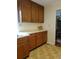 A kitchen featuring classic wood cabinetry and a neutral countertop provides ample storage and workspace at 5864 Crestwood Dr., Myrtle Beach, SC 29578