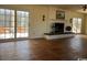 Bright living room with hardwood flooring, fireplace, and access to an outdoor area through glass doors at 5864 Crestwood Dr., Myrtle Beach, SC 29578