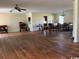 Spacious living room with hardwood floors, chandelier lighting, and an open layout to the dining area at 5864 Crestwood Dr., Myrtle Beach, SC 29578