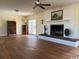 Large open living room with hardwood floors, a decorative fireplace, and access to the outdoors at 5864 Crestwood Dr., Myrtle Beach, SC 29578