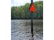 River view with warning sign. Calm water with surrounding lush greenery at 5864 Crestwood Dr., Myrtle Beach, SC 29578