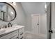 Elegant bathroom with marble vanity and a large mirror at 1055 Academy Dr., Conway, SC 29526