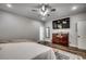 Main bedroom with large TV, dresser, and wood flooring at 1055 Academy Dr., Conway, SC 29526