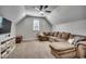 Spacious bonus room with a sectional sofa and a large TV at 1055 Academy Dr., Conway, SC 29526