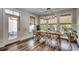 Bright dining room featuring a farmhouse table and access to the backyard at 1055 Academy Dr., Conway, SC 29526