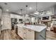 Open concept kitchen with island, white cabinets, and marble countertops at 1055 Academy Dr., Conway, SC 29526