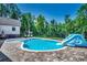 Enjoy this refreshing kidney shaped pool, complete with a slide and brick patio at 1055 Academy Dr., Conway, SC 29526