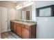 Bathroom with double vanity, granite countertop and large mirror at 1926 Bluff Dr., Myrtle Beach, SC 29577