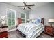 Comfortable bedroom with striped bedding and ceiling fan at 1926 Bluff Dr., Myrtle Beach, SC 29577