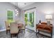 Kitchen dining area with four-person table and access to backyard patio at 1926 Bluff Dr., Myrtle Beach, SC 29577