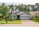 House exterior showing a charming craftsman style home with a two car garage and manicured lawn at 1926 Bluff Dr., Myrtle Beach, SC 29577