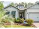 House exterior, featuring a light gray and white color scheme, and a covered entryway at 1926 Bluff Dr., Myrtle Beach, SC 29577