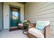 Inviting front porch with two wicker chairs, providing a relaxing spot at 1926 Bluff Dr., Myrtle Beach, SC 29577