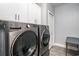 Bright laundry room, featuring LG washer and dryer, and built-in cabinets at 1926 Bluff Dr., Myrtle Beach, SC 29577