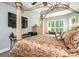 Main bedroom with a large four-poster bed and mounted TV at 1926 Bluff Dr., Myrtle Beach, SC 29577