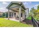 Covered patio with brick flooring, ceiling fan, and outdoor seating at 1926 Bluff Dr., Myrtle Beach, SC 29577