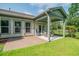 Covered patio with brick flooring, ceiling fan, and outdoor seating at 1926 Bluff Dr., Myrtle Beach, SC 29577