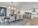 Open dining room with large table and view into kitchen at 2020 Santa Maria St., Myrtle Beach, SC 29579