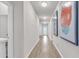 Bright hallway with light wood floors and modern art at 2020 Santa Maria St., Myrtle Beach, SC 29579