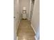 Bright hallway with wood-look flooring and white trim at 2020 Santa Maria St., Myrtle Beach, SC 29579