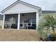 Relaxing screened porch with pond view and string lights at 2020 Santa Maria St., Myrtle Beach, SC 29579