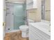 Bathroom with shower, toilet, vanity with sink, and storage cabinet at 4709 Wild Iris Dr. # 104, Myrtle Beach, SC 29577