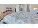 Main bedroom featuring a queen bed with coastal-themed linens and access to bathroom at 4709 Wild Iris Dr. # 104, Myrtle Beach, SC 29577