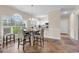 Dining area adjacent to the kitchen, with ample natural light from the large window at 4709 Wild Iris Dr. # 104, Myrtle Beach, SC 29577