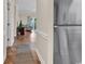 Hallway leading to a living area with access to outdoor balcony at 4709 Wild Iris Dr. # 104, Myrtle Beach, SC 29577