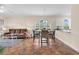 Open-concept living and dining area featuring tile floors and lots of natural light at 4709 Wild Iris Dr. # 104, Myrtle Beach, SC 29577