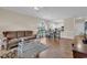 Cozy living room with a plush sofa, tile floors, and an open layout to the kitchen and dining area at 4709 Wild Iris Dr. # 104, Myrtle Beach, SC 29577