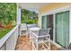 Outdoor patio with a table and chairs, offering a relaxing space to enjoy the scenery at 4709 Wild Iris Dr. # 104, Myrtle Beach, SC 29577