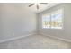 Bedroom with carpeted floor, ceiling fan and large window at 107 Infinity Ln., Loris, SC 29569