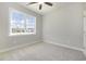 Bright bedroom with carpeted floor and ceiling fan at 107 Infinity Ln., Loris, SC 29569