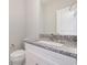 Bathroom vanity with granite countertops, white cabinets, and a modern sink and faucet at 112 Infinity Ln., Loris, SC 29569