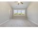 Well-lit carpeted bedroom featuring a ceiling fan, large windows, and neutral wall color at 112 Infinity Ln., Loris, SC 29569